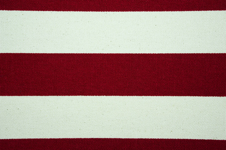 红色和白色的条纹的帆布质地和背景