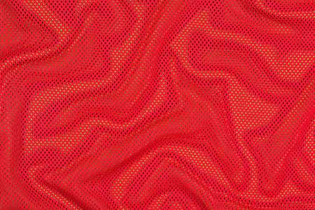 绿色上的红色褶皱无纺布照片