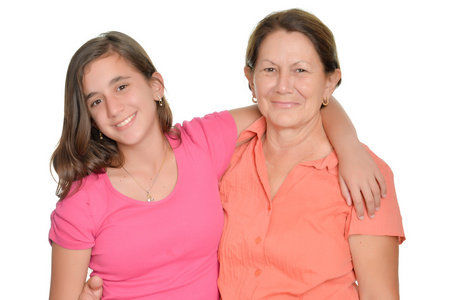 西班牙裔美国人十几岁的女孩和她的祖母上白色孤立