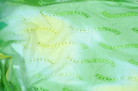 丝绸面料质地，背景..绿色和黄色