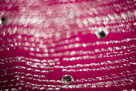 模糊的粉红色纺织与假钻