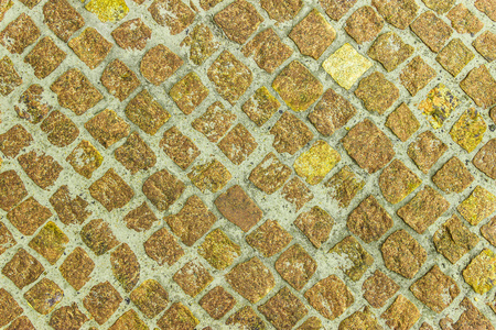 天然石铺路黄金天然石背景照片