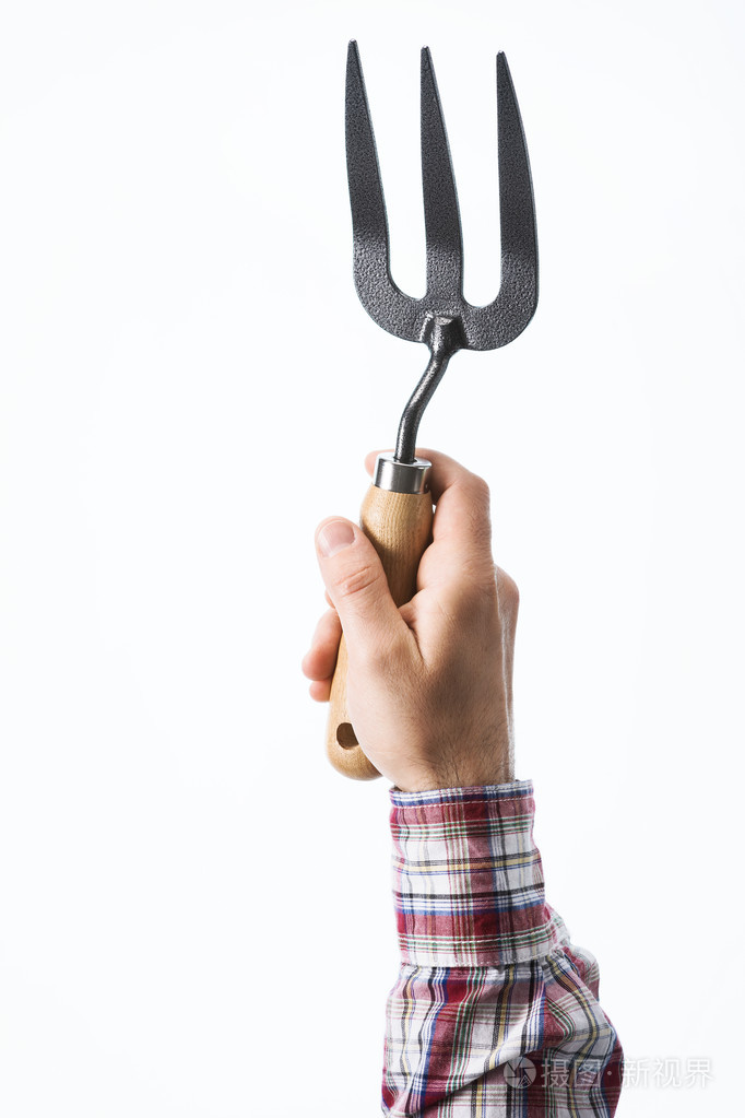手拿着园艺叉子照片-正版商用图片1jl7az-摄图新视界