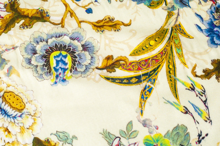纹理背景缎纹织物米色与花卉图案。 一种光滑光滑的丝绸织物