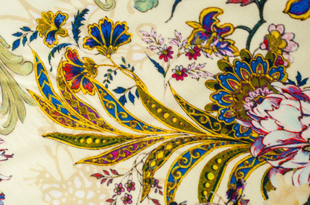 纹理背景缎纹织物米色与花卉图案。 一种光滑光滑的丝绸织物