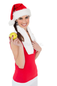 节日合身的黑发女人拿着苹果