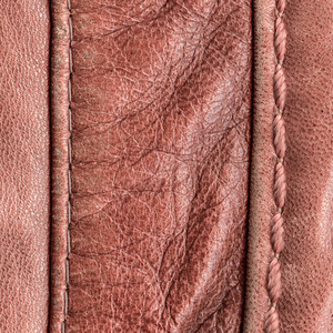 红棕色皮革纹理，接缝。有用的背景