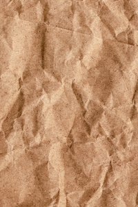 棕色回收牛皮纸纸包皱的 Grunge 纹理样本