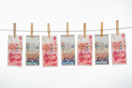 中国和马来西亚货币在晾衣绳上