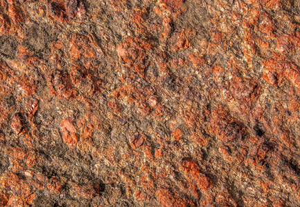 红色花岗岩表面粗糙的背景图片