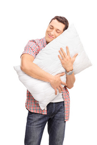 快乐的人抱着一个枕头图片