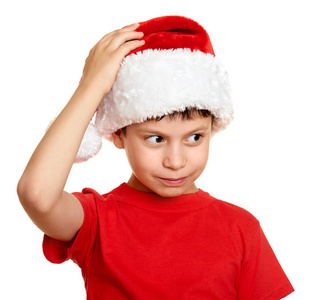 冬季假期圣诞节概念   圣诞老人帽子肖像上分离出的白色的男孩