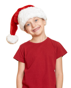 在圣诞老人的帽子上白色隔离的女孩