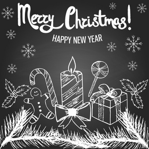 圣诞贺卡用一只手在黑板上绘制元素