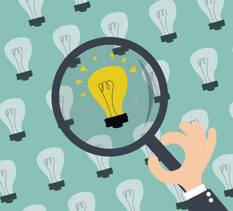 寻找创意-灯泡和手拿放大镜照片