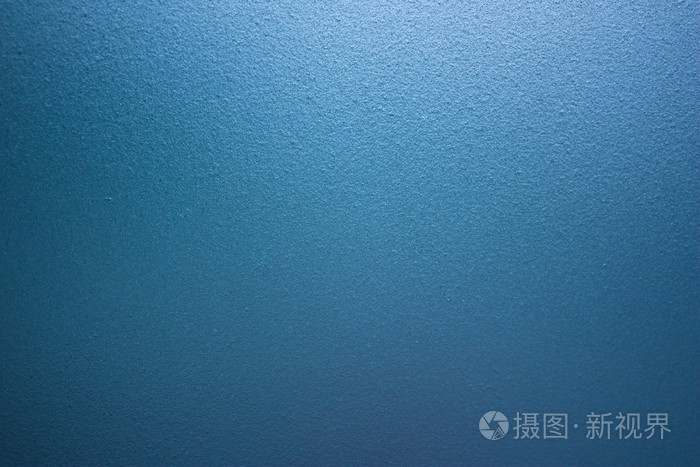 蓝色的粗磨砂的玻璃墙背景