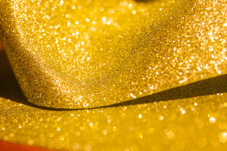 金色闪光圣诞抽象背景.闪亮的金色光芒照片