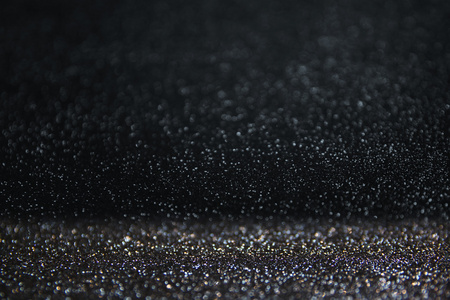 闪光复古灯背景.亮银色, 蓝色和黑色.离焦照片