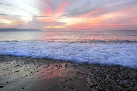 海滩日落波