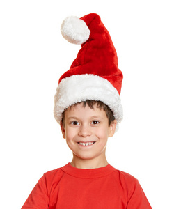 冬季假期圣诞节概念   圣诞老人帽子肖像上分离出的白色的男孩