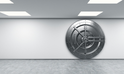 一个锁着的大圆金属保险箱在银行存款