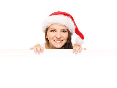 漂亮的少女戴着圣诞帽，还有一块空白的广告牌