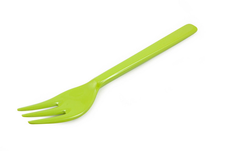孤立的白色背景上的绿色塑料餐叉
