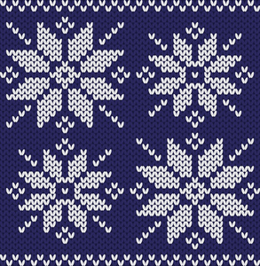 暗蓝色背景上的针织的雪花。水平无缝针织的图案