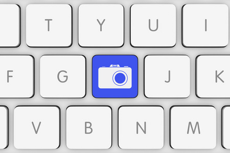 在白色的电脑键盘上的蓝色照片图标按钮