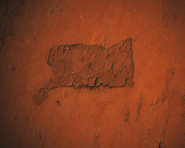 用橙色涂漆的扁平金属表面照片