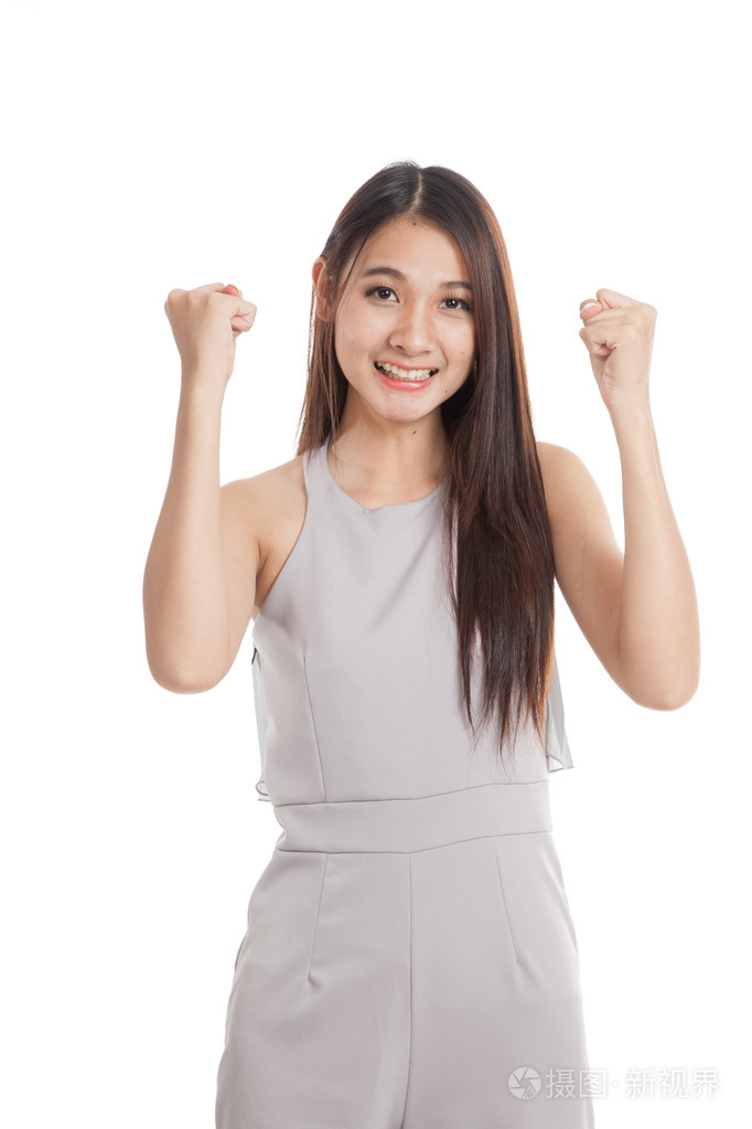 成功的年轻亚洲女人抓住拳头了照片-正版商用图片1le8i3-摄图新视界