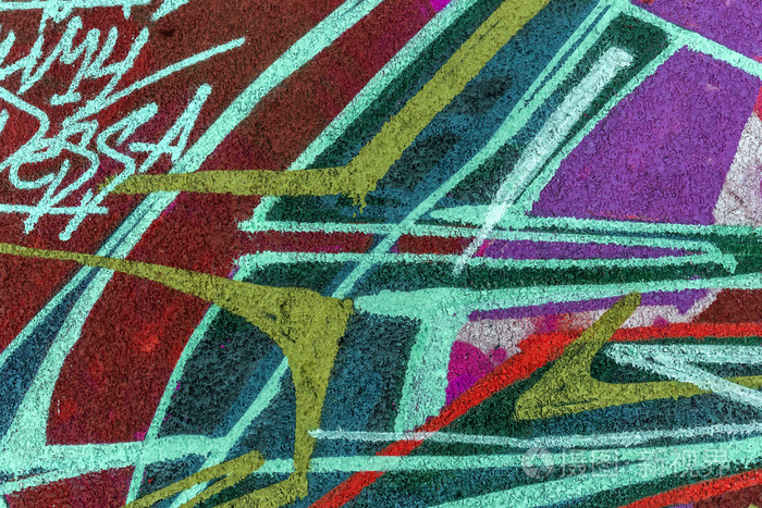 美丽的街道艺术涂鸦. 抽象创意在城市的墙壁上绘制时尚色彩.