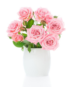 束美丽的新鲜的粉红色玫瑰，在一个白色的花瓶