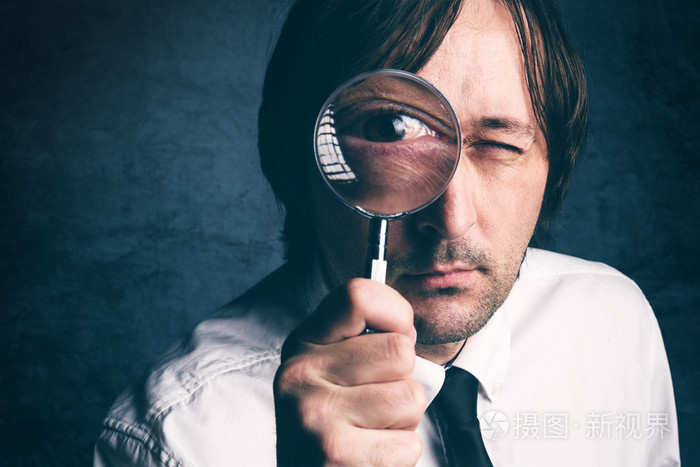 商人用放大镜,做金融的税务稽查员照片-正版商用图片1lzd41-摄图新