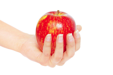 在女性手中的红苹果