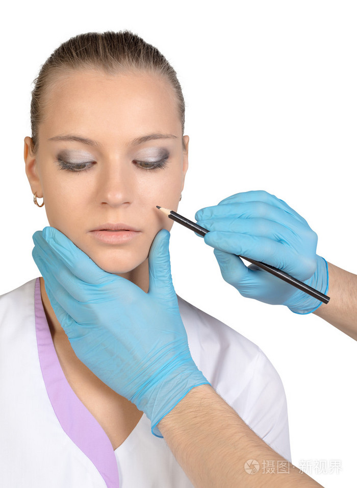 美丽女人脸手术制作标记上的关闭了画像.女模特