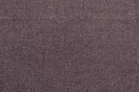 从面料的淡咖啡色斑点带纹理的单色背景照片