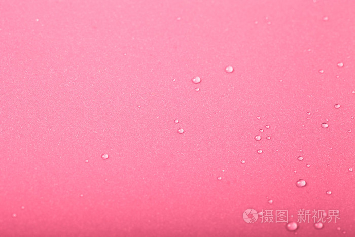 彩色背景上的水珠.粉红色.浅浅的深度国际剑联