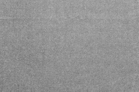 灰色斑点纹理从面料的灰色斑点带纹理的单色背景照片