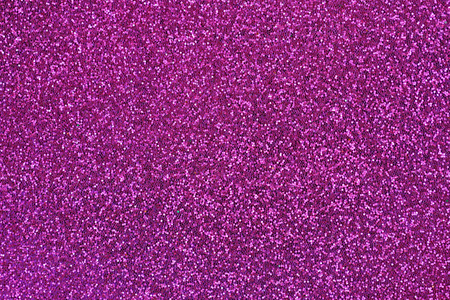 在洋红色闪烁的抽象背景闪闪发光的纹理照片照片