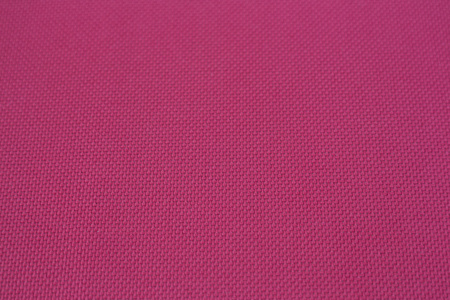 粉红色的布材料背景纹理