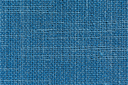 浅蓝色织物背景与明确的画布纹理