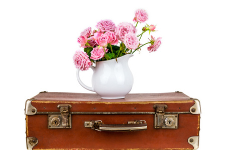 花在壶上旧的棕色复古手提箱