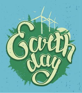 4 月 22 日世界地球日。绿色地球和风的能量。地球日刻字文本