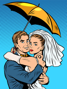新婚夫妇在一把伞下相爱的新娘和新郎