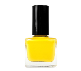 白色背景上的黄色的指甲油瓶