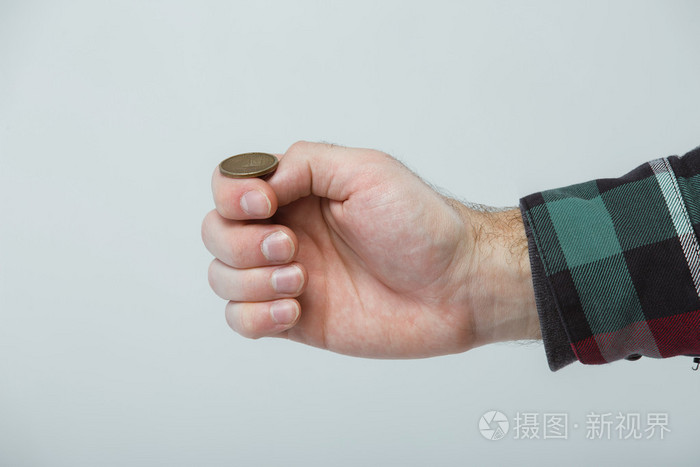 男人的手,扔硬币,头和尾巴