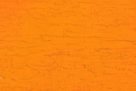 用油漆纹理和背景的木板。橙色作为一份空间背景画木板。剥落的油漆的纹理。单色表面。水平方向