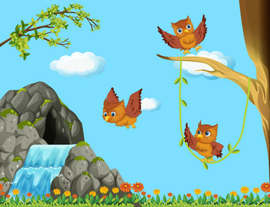 三个猫头鹰飞在瀑布图片