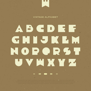 一组程式化字母表字母孤立在棕色背景上。